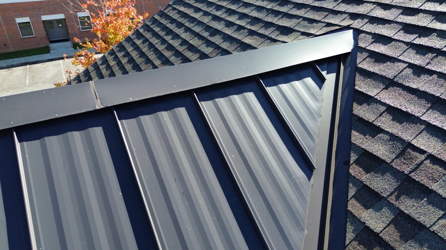 Metal and shingle roofing detail